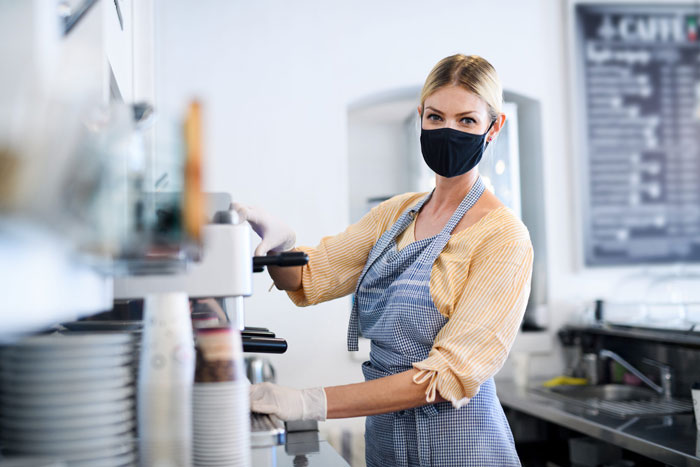 coffee-shop-woman-owner-working-with-face-mask-ope-AJKDJYU-scaled - copia